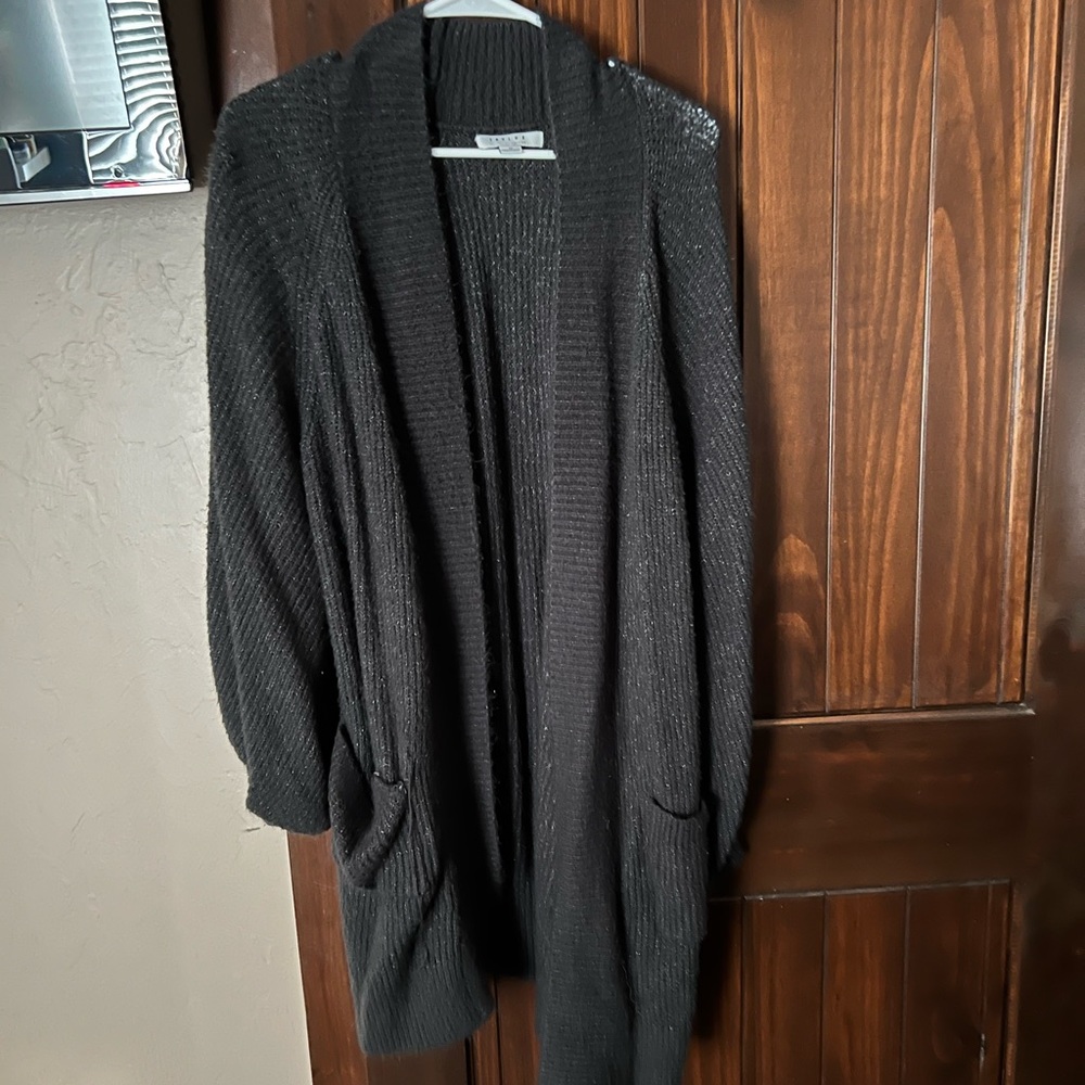 more like a large. very cozy and long with pockets!